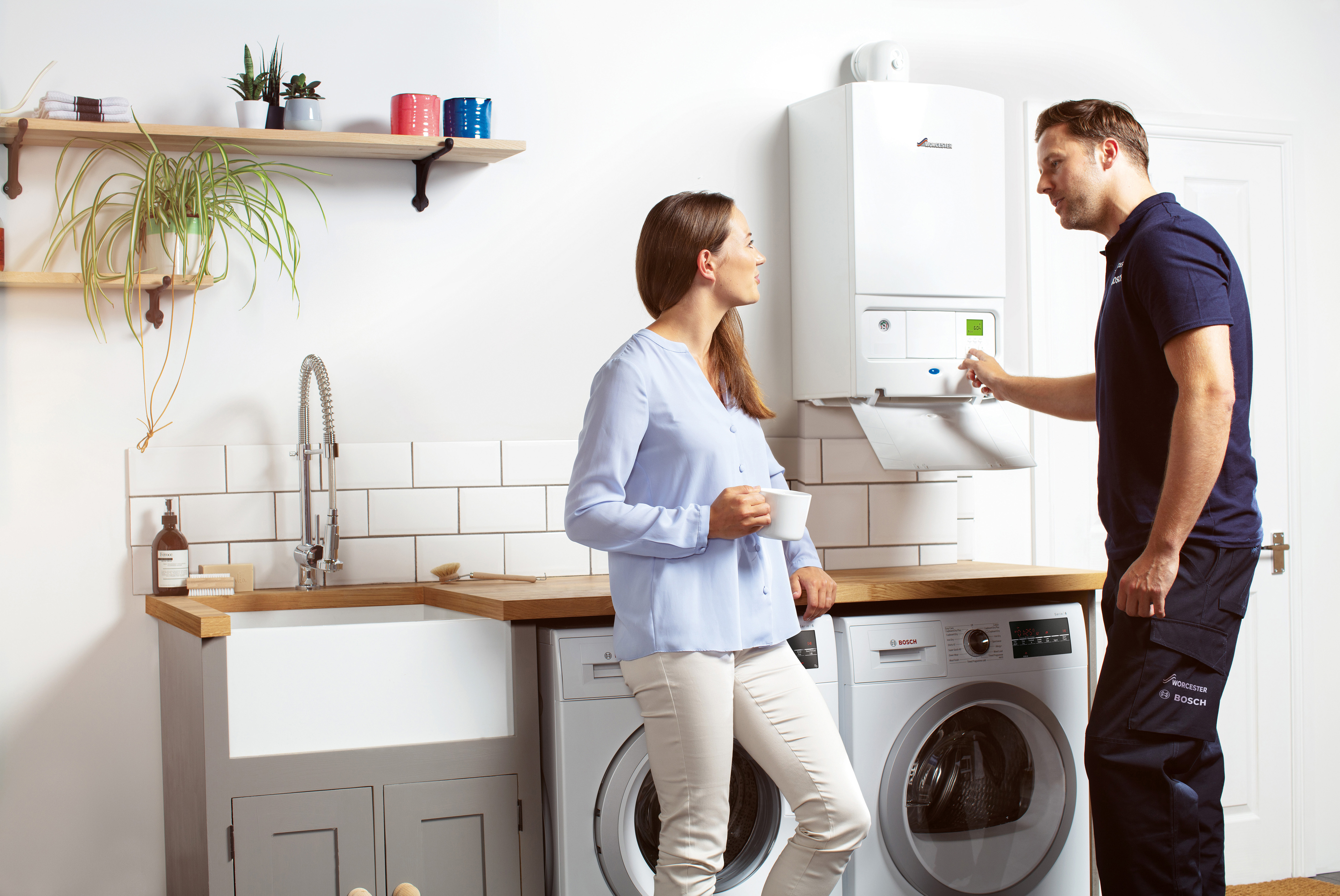 Enginner explaining boiler service to customer